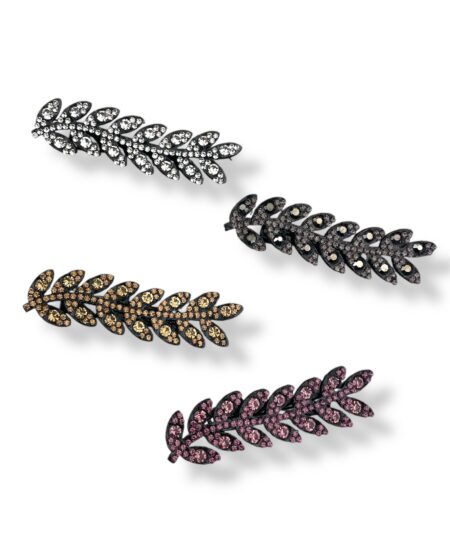 Elegant hårklemme med sten formet som blade på filt. Et dekorativt håraccessory, der giver din frisure et feminint og naturinspireret udtryk.